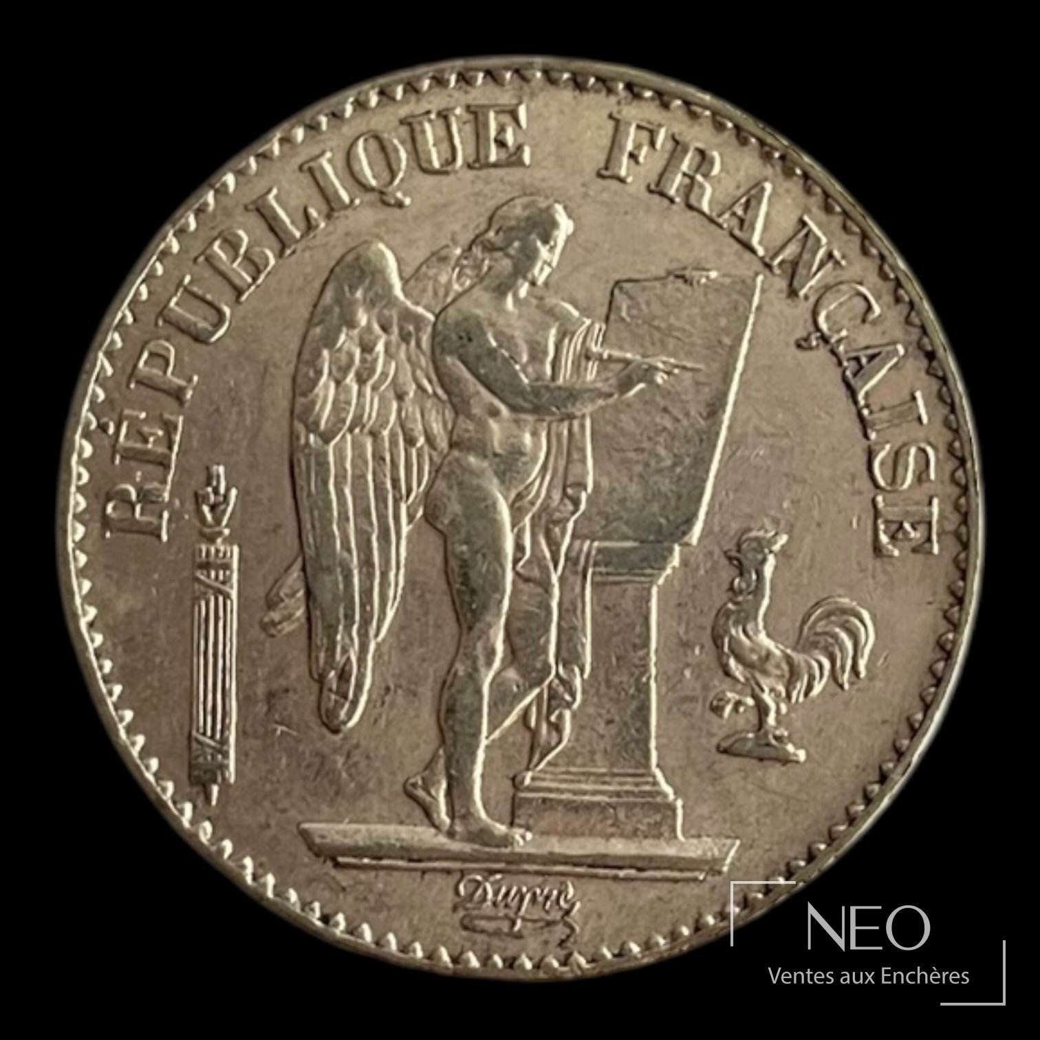 Face d'une pièce de 20 francs en or Génie ailé avec le Génie debout et la légende République française