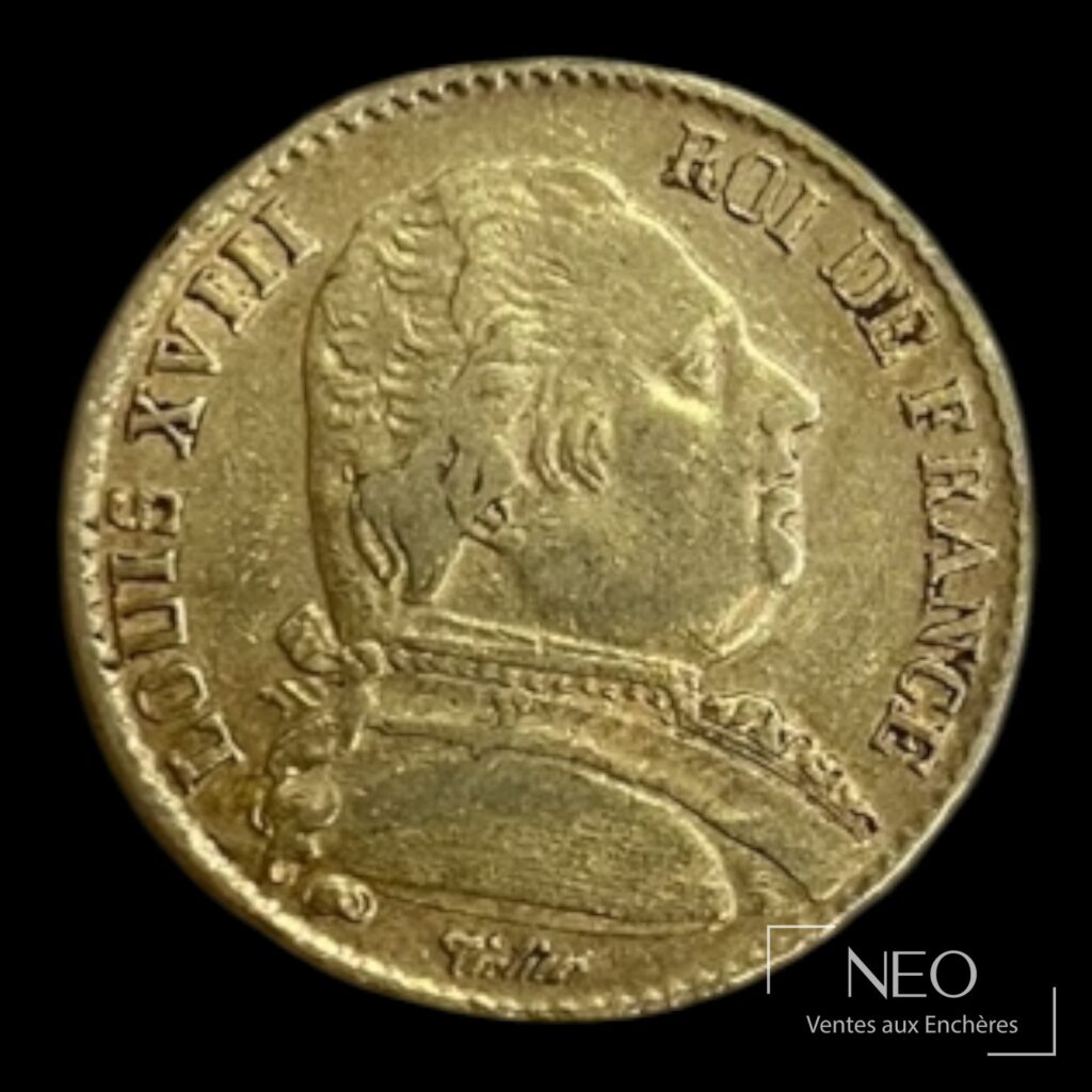 Avers d'une pièce de 20 francs or Louis XVIII tête nue avec légende circulaire.