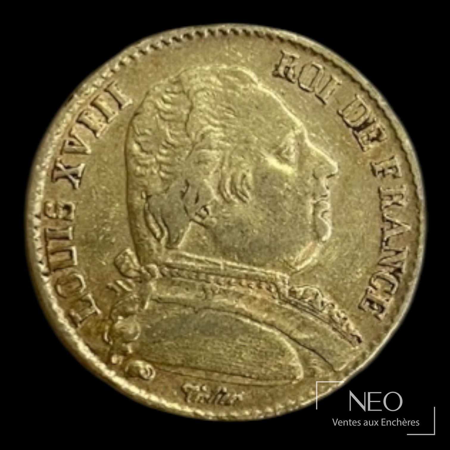 Avers d'une pièce de 20 francs or Louis XVIII tête nue avec légende circulaire.