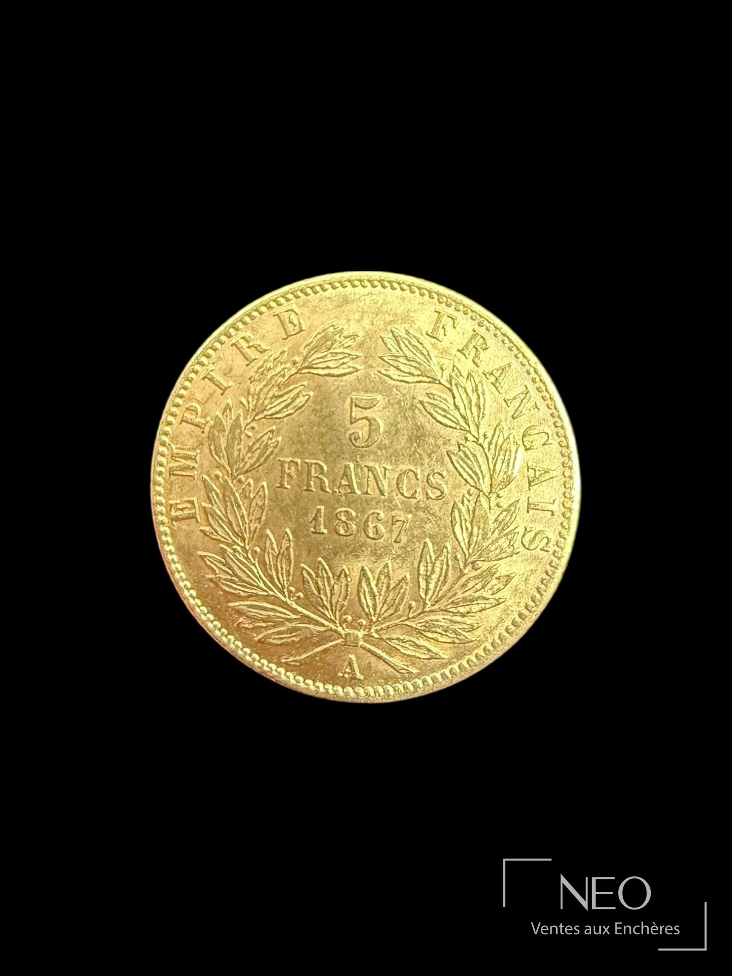 Revers d'une pièce de 5 francs or avec la valeur 5 FRANCS et une couronne de laurier