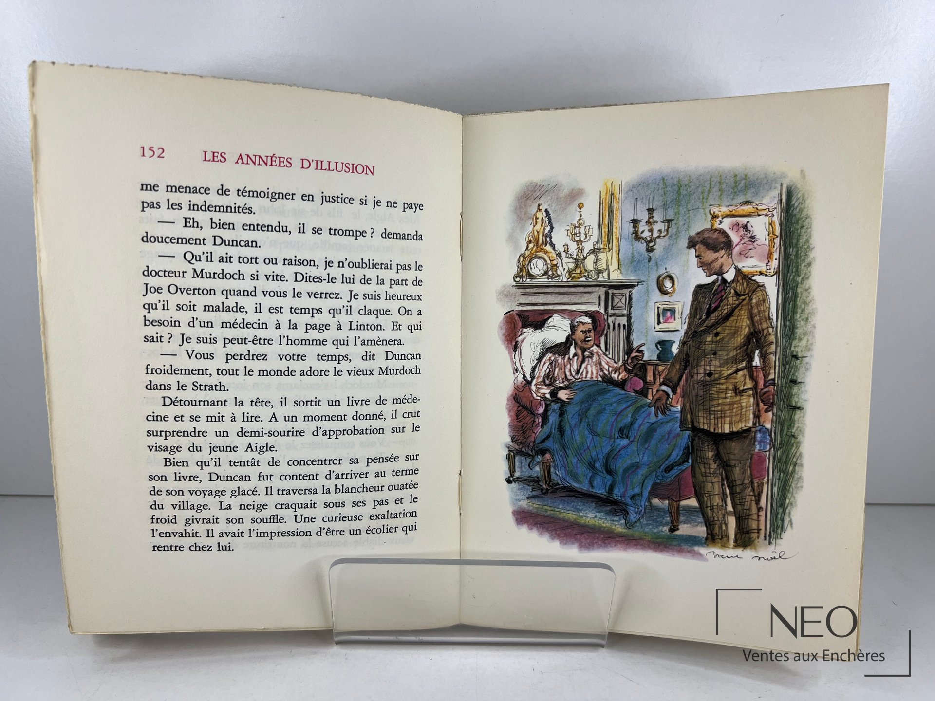Livre ouvert montrant une page de texte et une illustration en couleurs