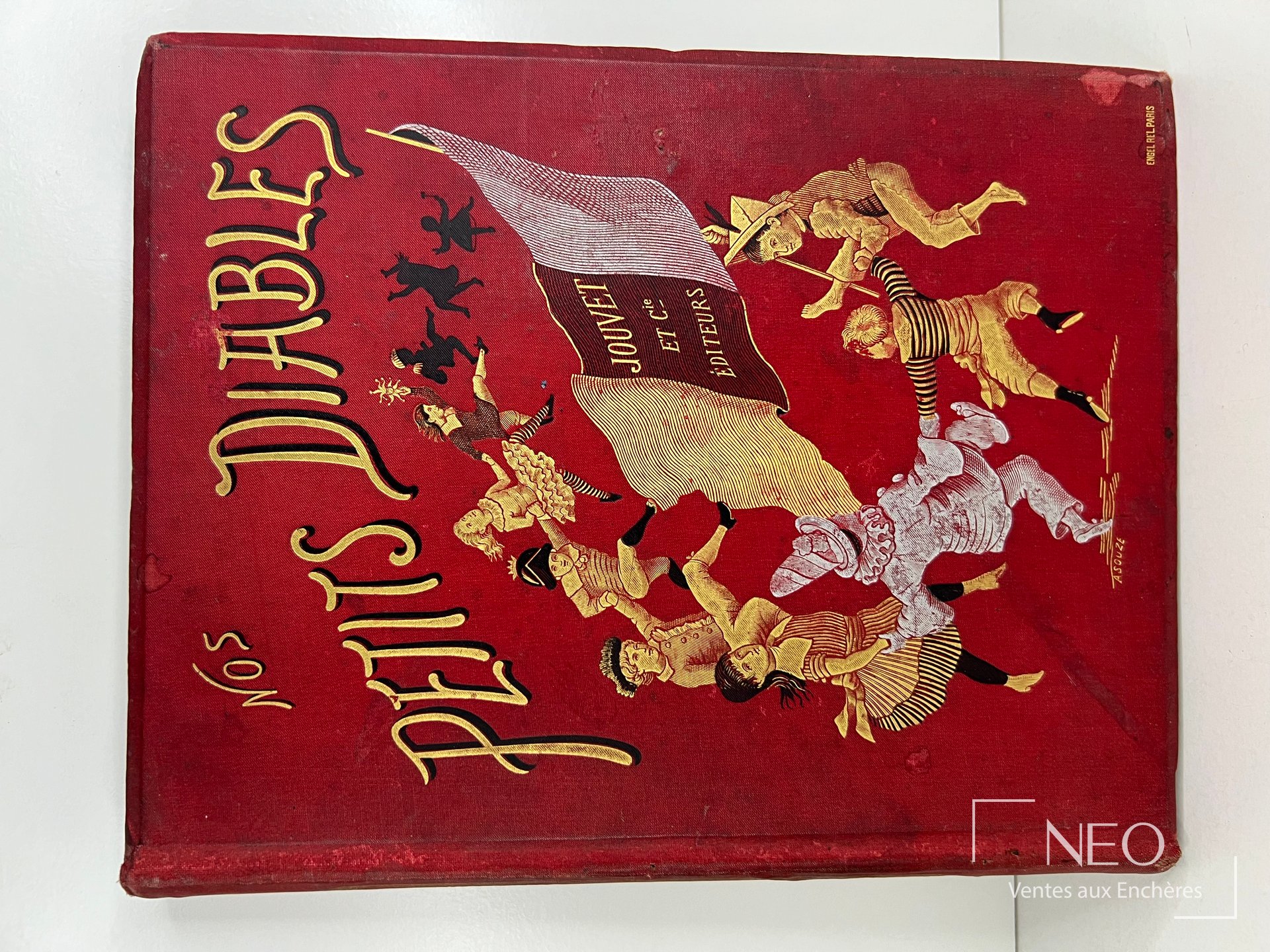Couverture rouge de Nos petits diables d’Albert Girard avec titre doré et scène d’enfants