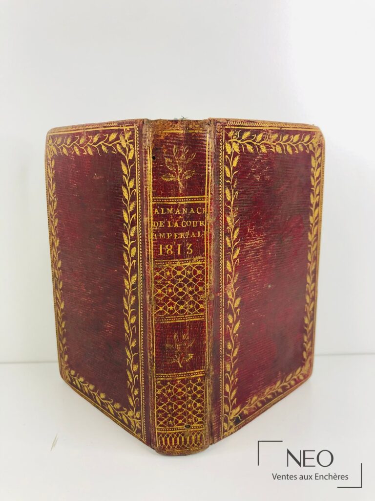 Reliure en maroquin cerise ornée de dorures et dos titré Almanach de la cour impériale 1813