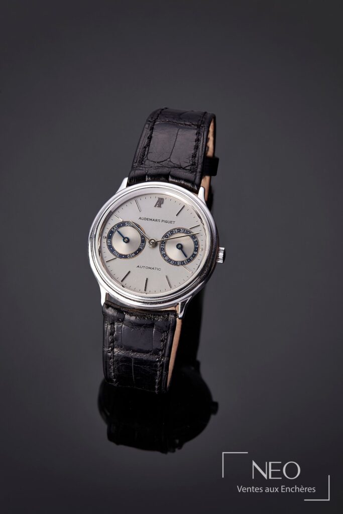 Montre Audemars Piguet Day Date en or gris sur bracelet cuir noir