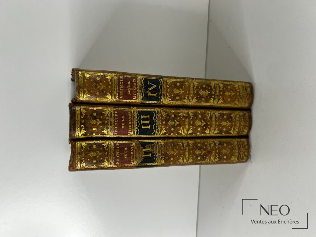 Trois volumes reliés en veau à dos ornés de dorures et pièces de titre rouges et noires