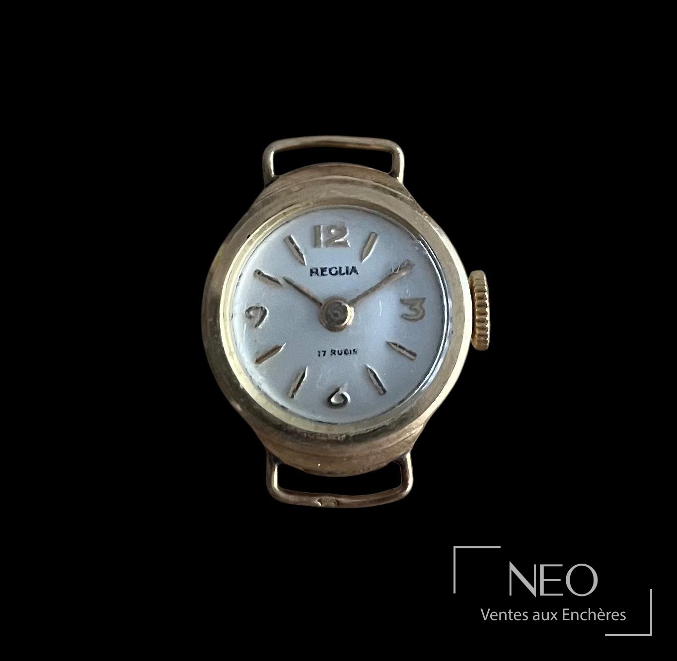 Boîtier de montre Reglia en or jaune avec cadran champagne et index appliqués