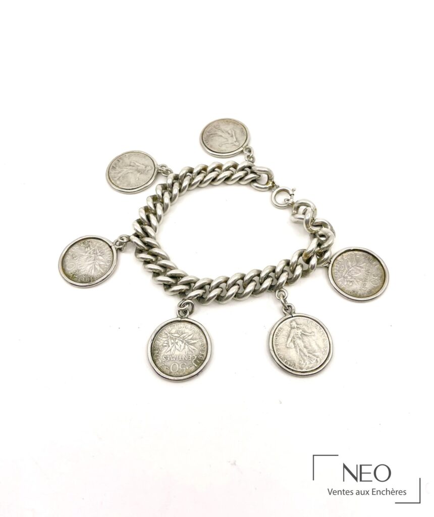 Bracelet en argent à mailles souples orné de six pièces de 50 centimes semeuse
