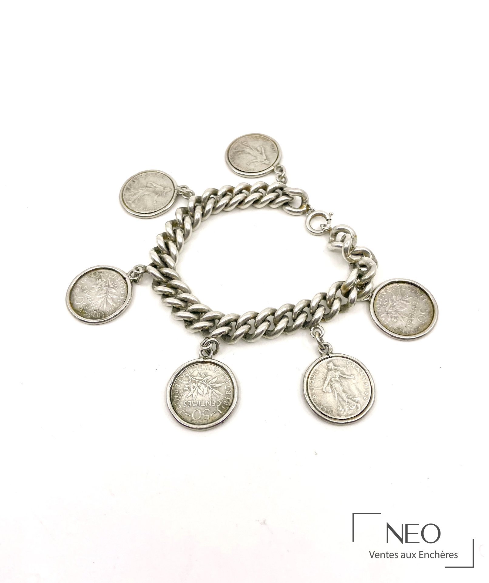 Bracelet en argent à mailles souples orné de six pièces de 50 centimes semeuse