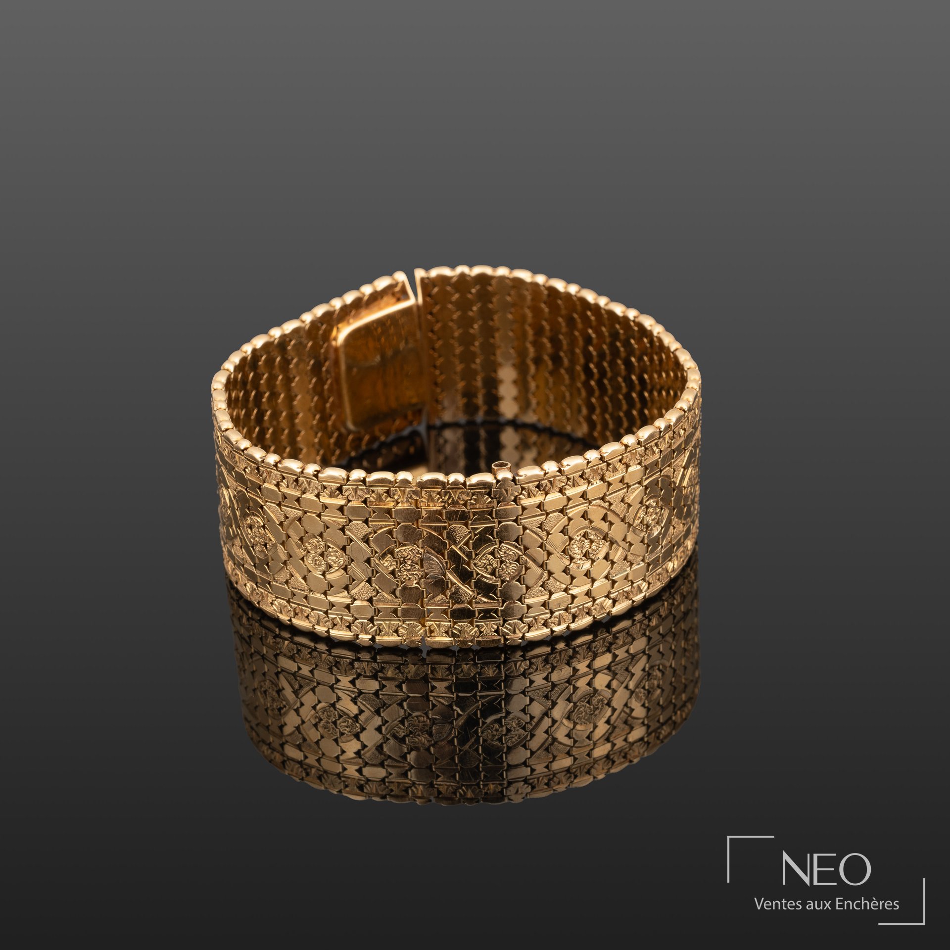 Bracelet jonc articulé en or jaune 18K à maille fantaisie souple
