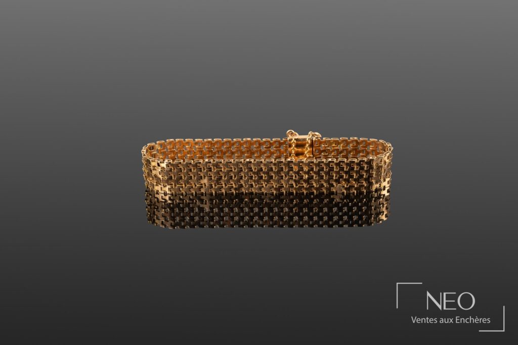 Bracelet manchette en or jaune à mailles articulées