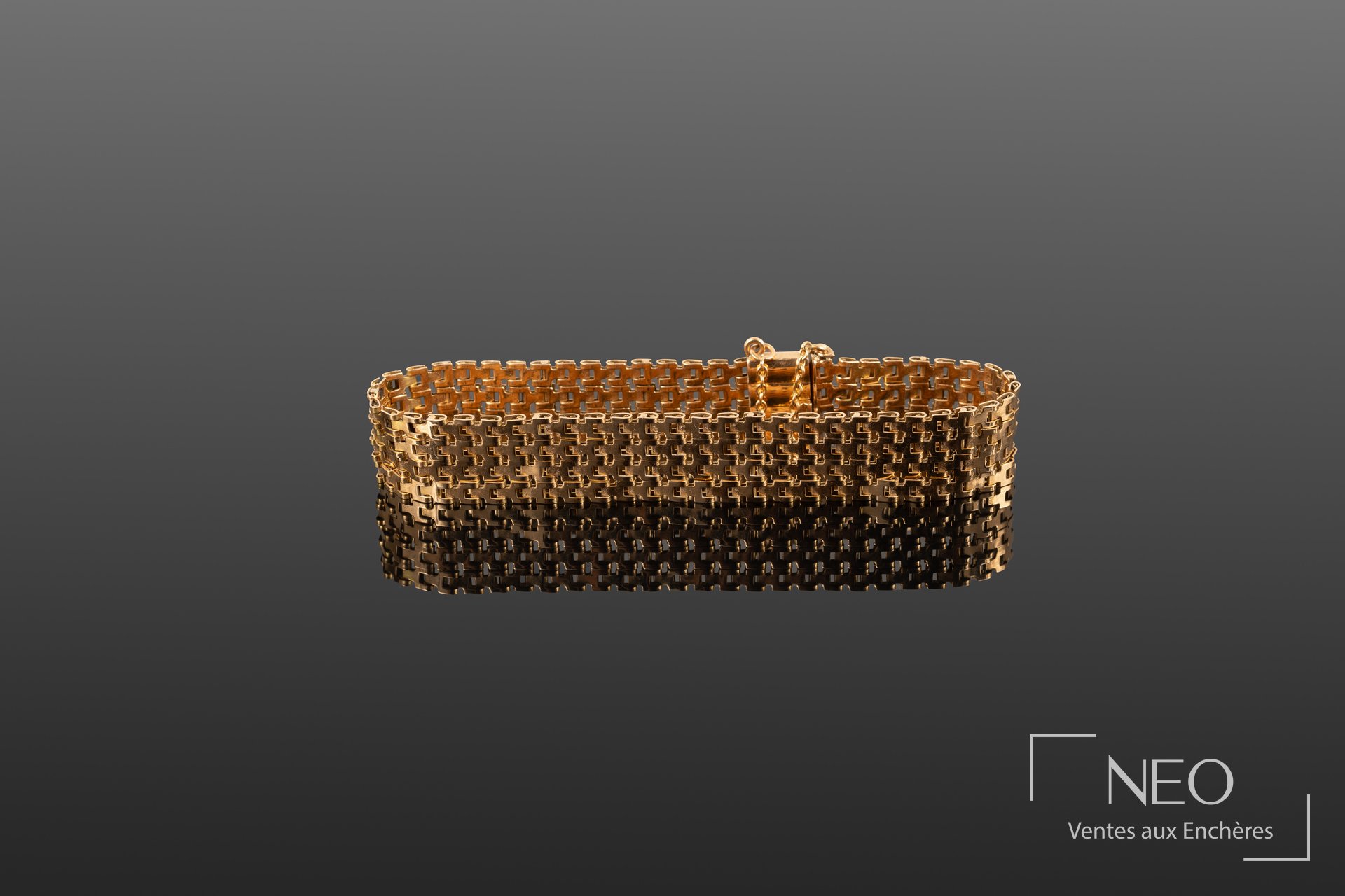 Bracelet manchette en or jaune à mailles articulées