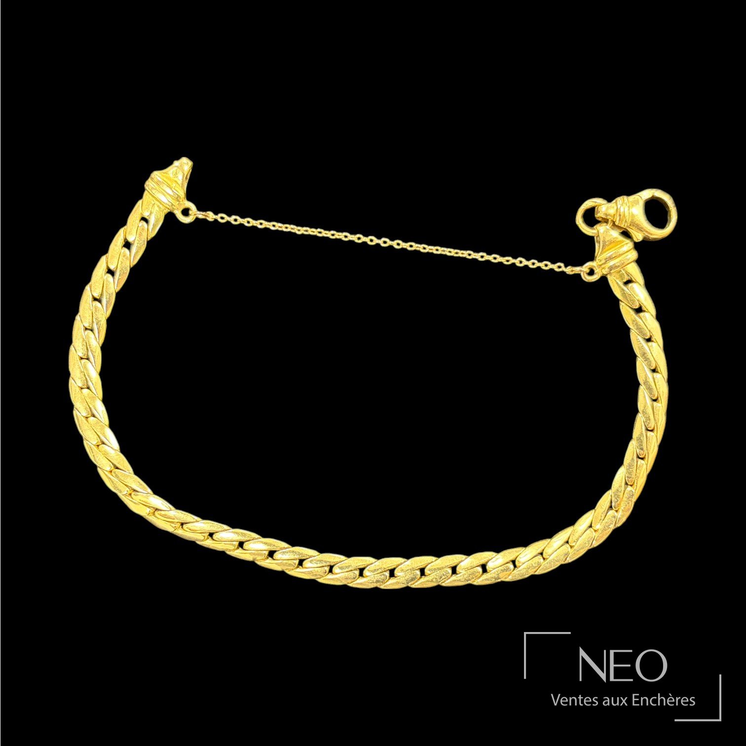 Bracelet en or jaune à maille anglaise avec fermoir mousqueton et chaînette de sécurité