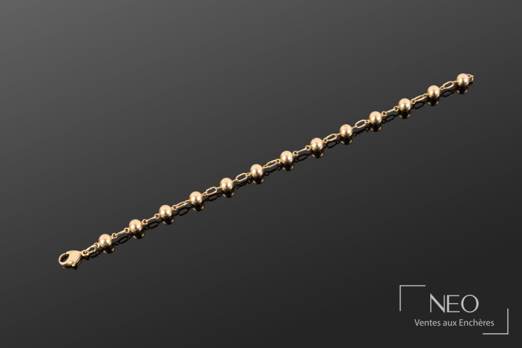 Bracelet en or jaune à boules et maillons