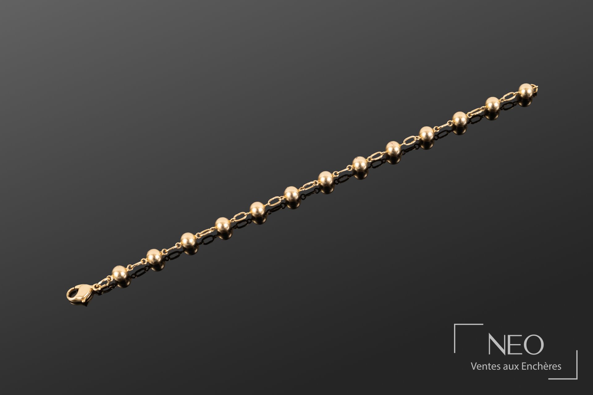Bracelet en or jaune à boules et maillons