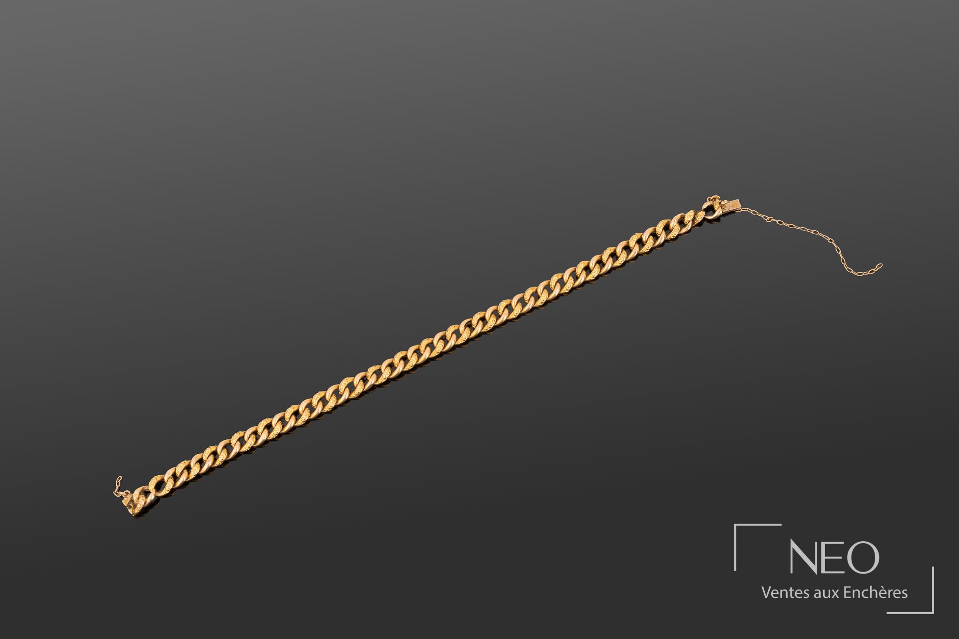 Bracelet en or jaune 18K à maille gourmette aplatie