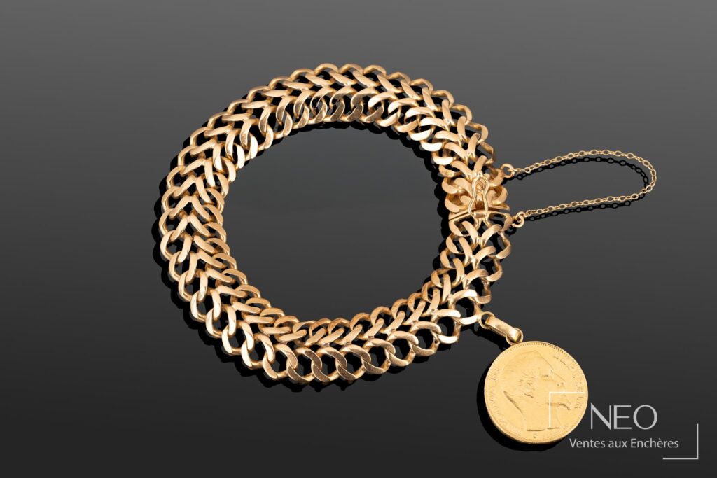 Bracelet en or rose à maille double gourmette avec pièce de 20 francs Napoléon III