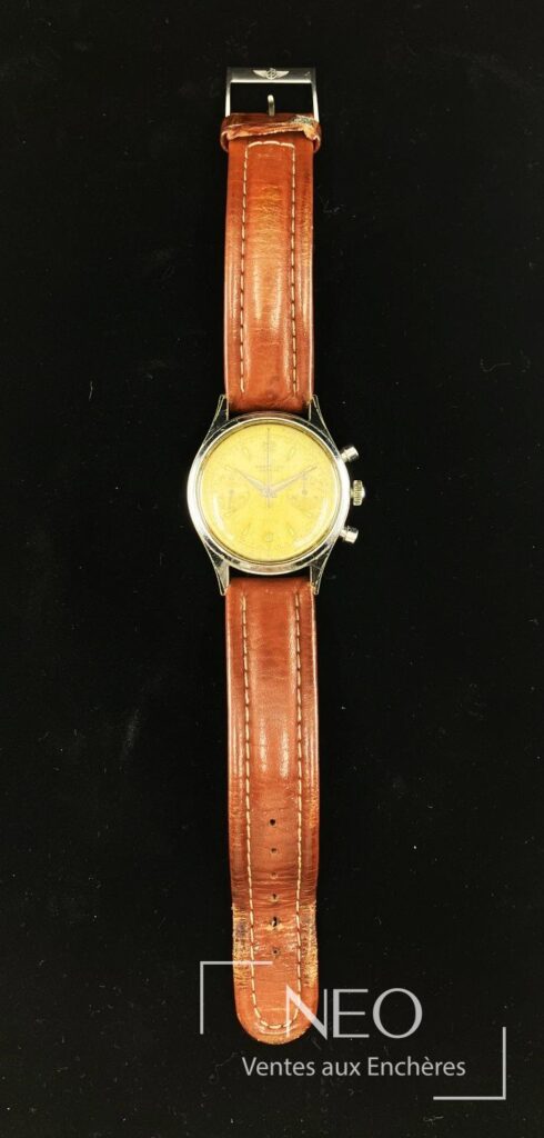 Montre Breitling chronographe à cadran doré sur bracelet en cuir brun