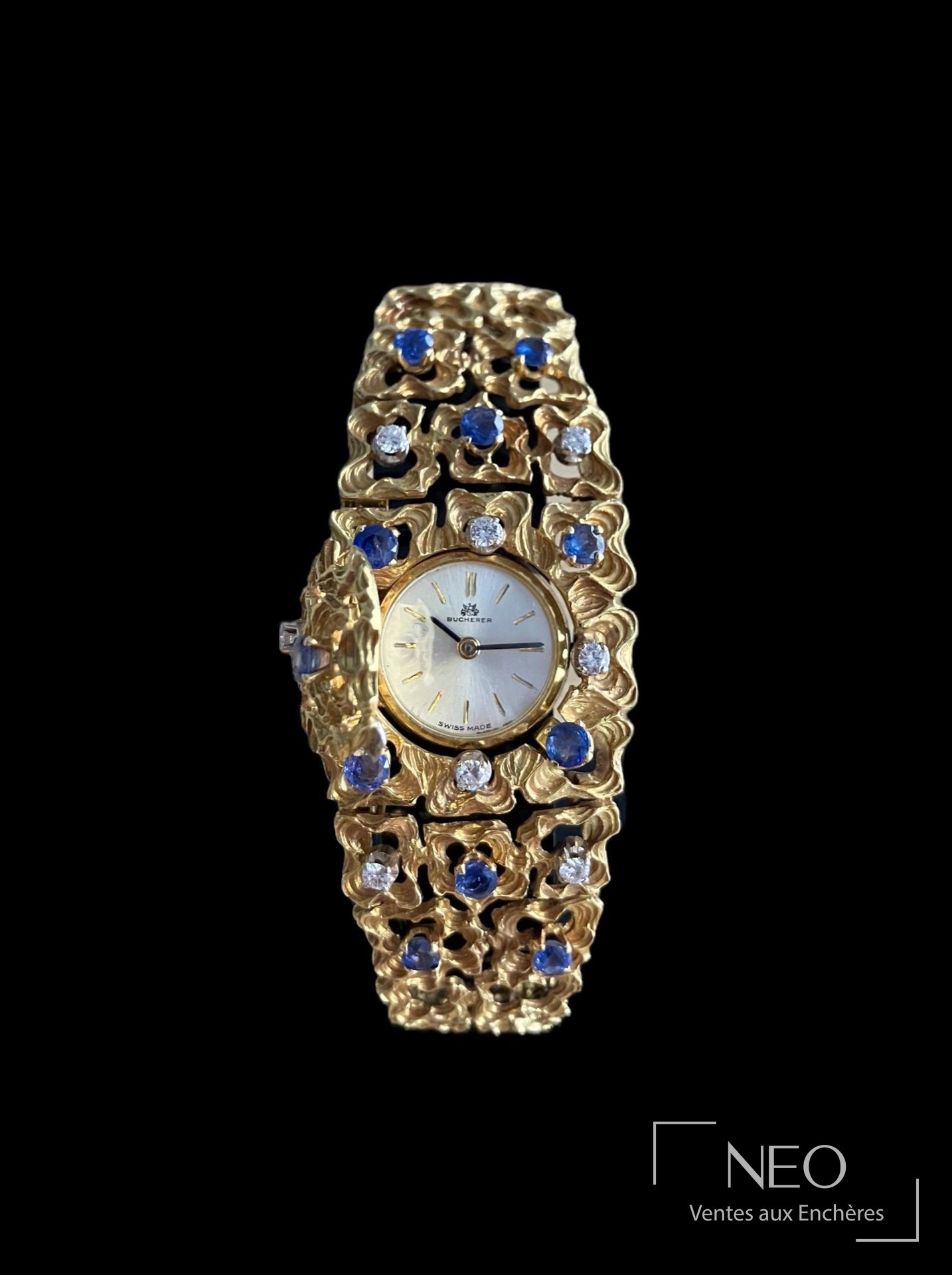Montre bracelet Bucherer en or jaune sertie de diamants et saphirs
