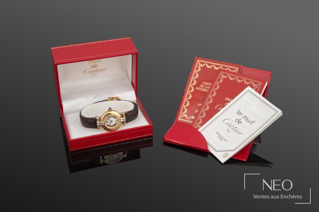 Montre Cartier Must Vendôme de dame dans son écrin rouge avec sa documentation
