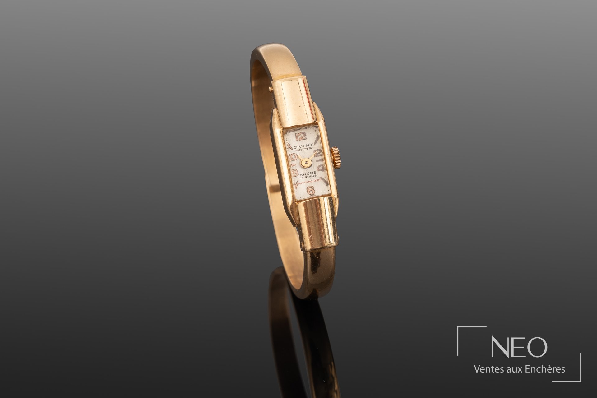 Montre-bracelet CAUNY Prima en or jaune avec cadran rectangulaire champagne