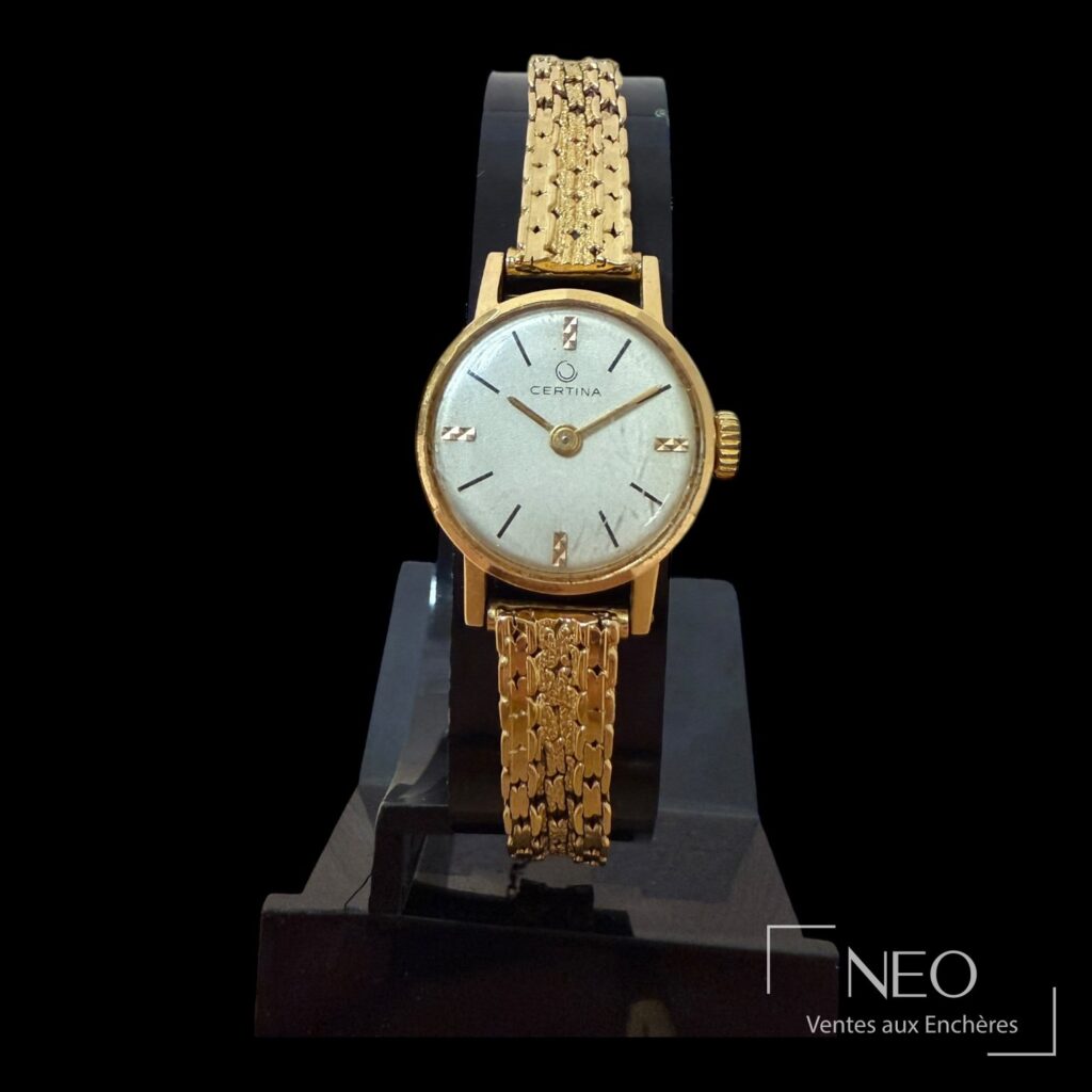 Montre CERTINA en or jaune avec cadran gris et bracelet souple assorti