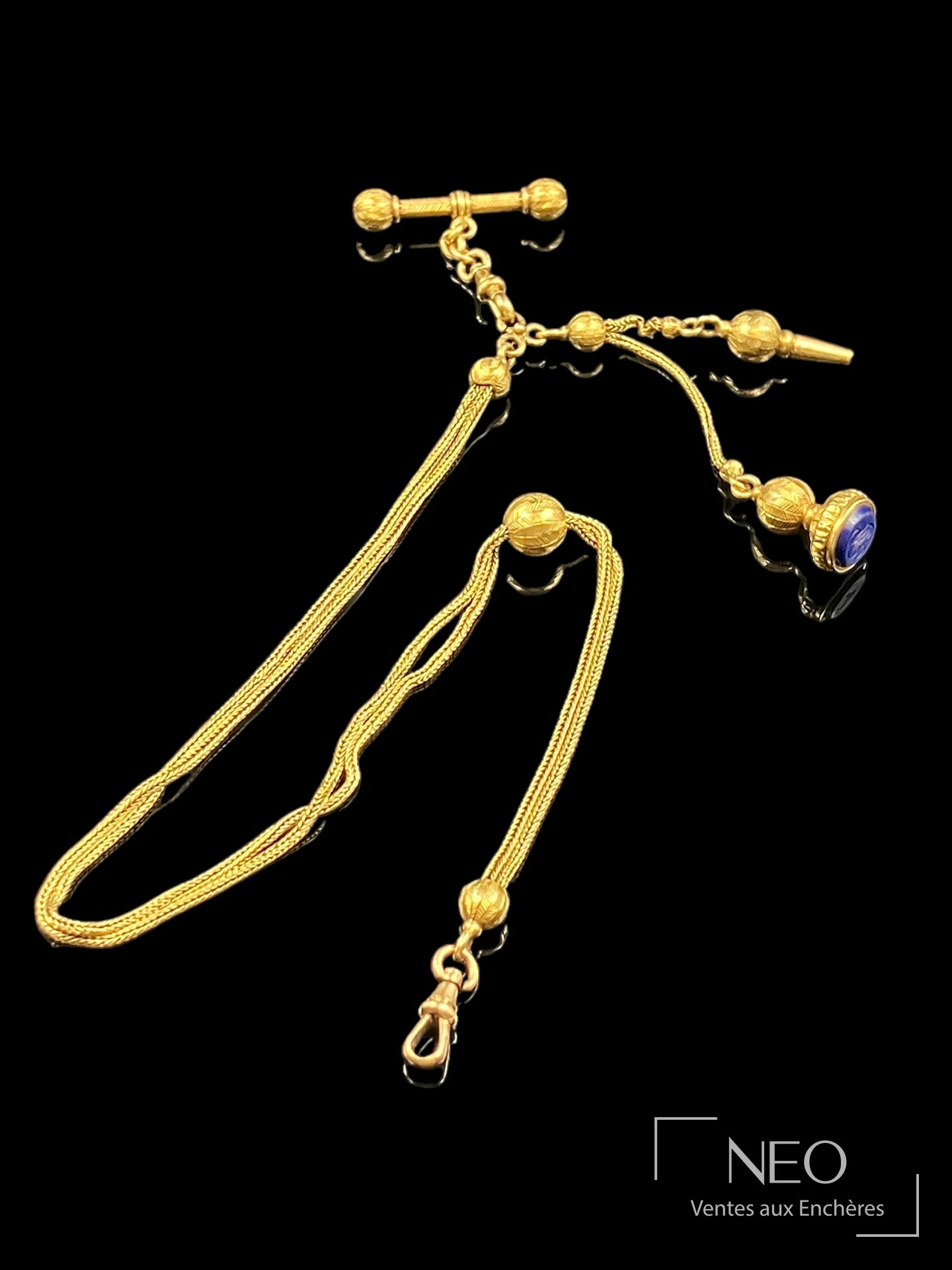 Chaîne giletière en or jaune 18 carats, sceau monogrammé LM