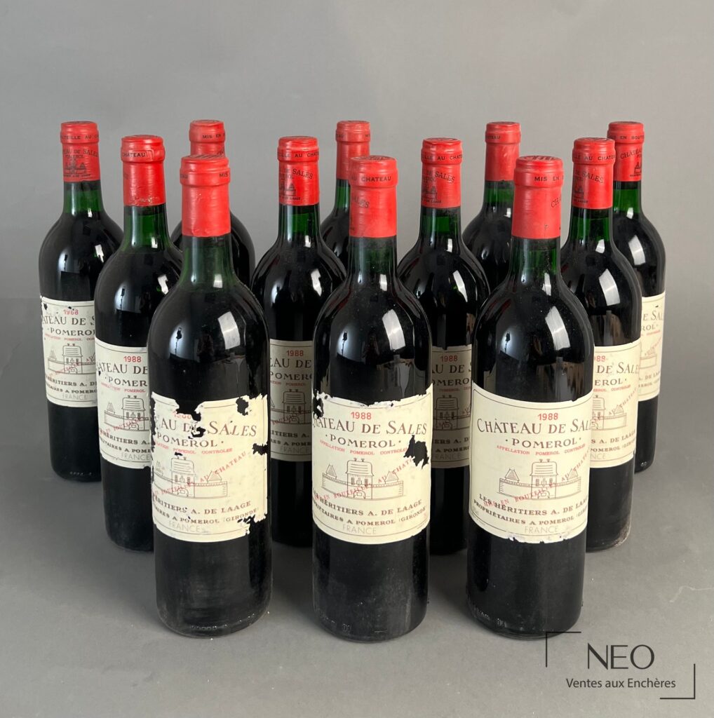 Douze bouteilles de Château de Sales Pomerol 1988 présentées de face