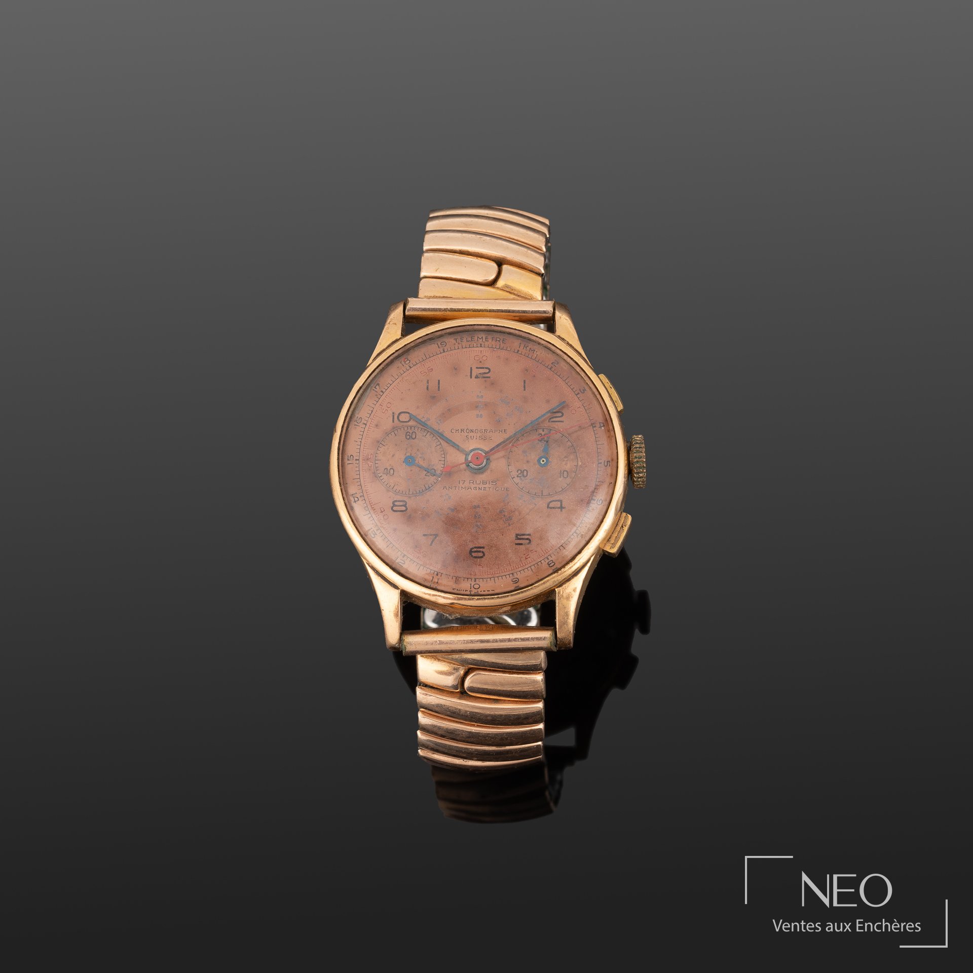 Montre chronographe suisse en or jaune et acier