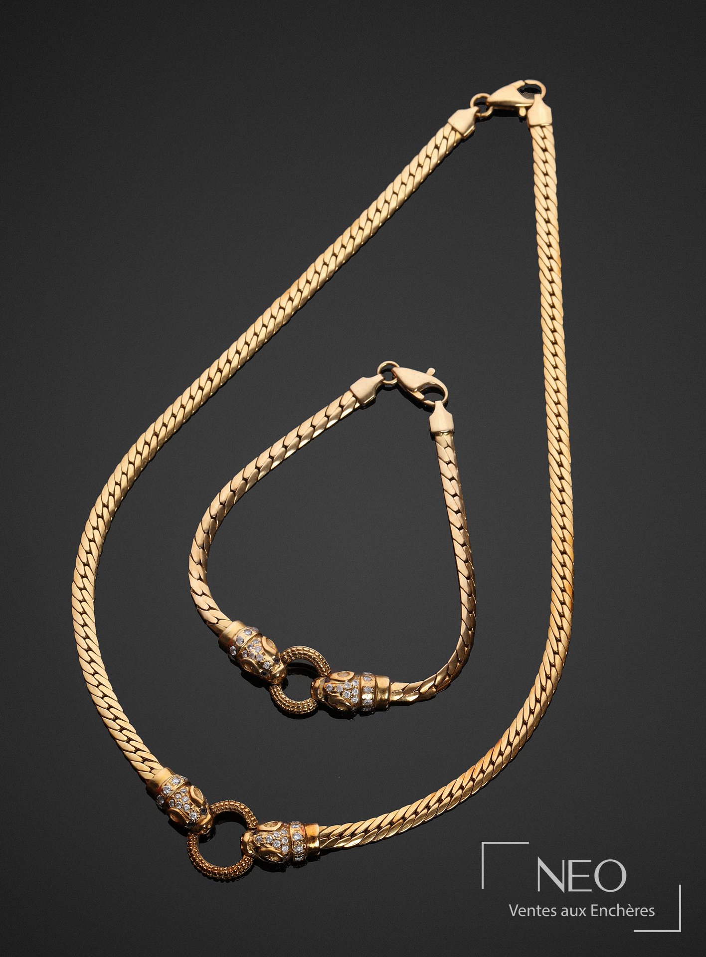 Demi-parure en or jaune 18 carats à têtes de félins