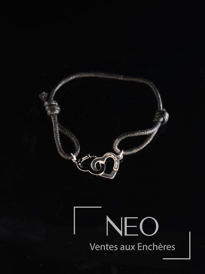 Bracelet Dinh Van en or gris sur cordelette noire
