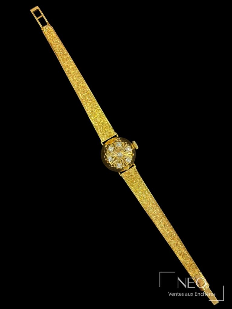 Montre bracelet FLAMOR en or jaune avec cadran rond doré et diamants