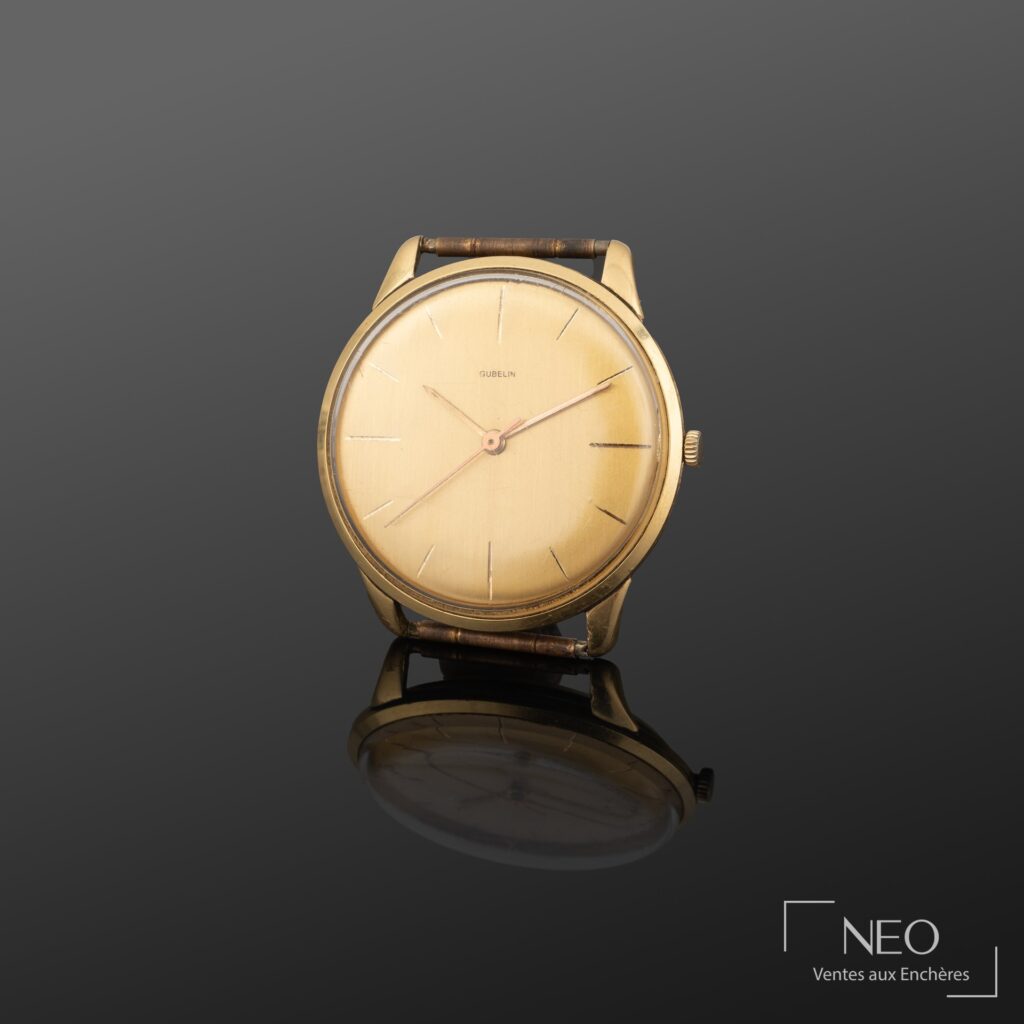 Montre bracelet GUBELIN en or jaune avec cadran doré et trotteuse centrale