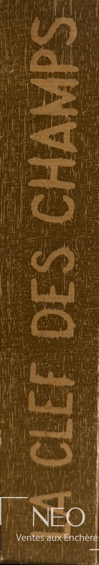 Dos de l'emboîtage avec le titre La clef des champs inscrit verticalement.