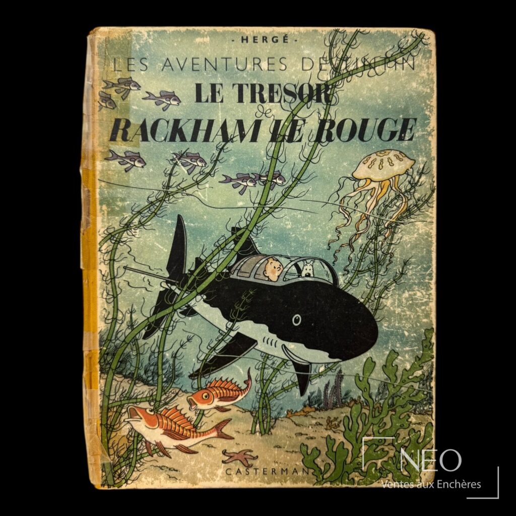 Couverture de Tintin Le Trésor de Rackham le Rouge avec décor marin et usures visibles