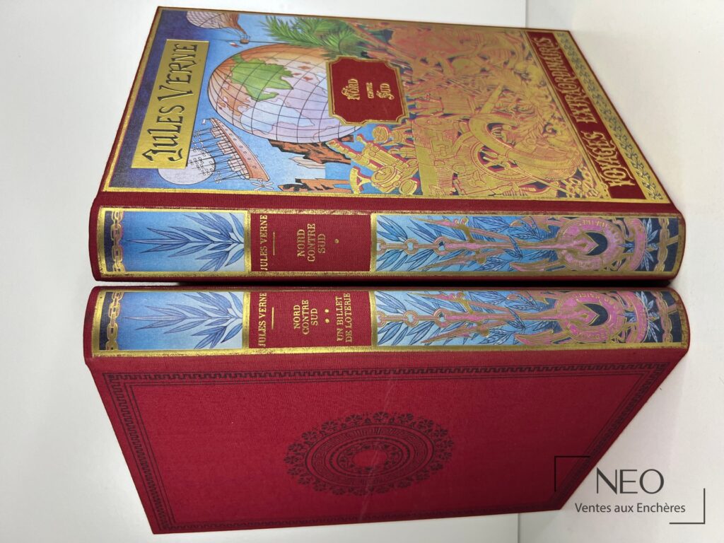Deux volumes Jules Verne en reliure rouge et décor polychrome