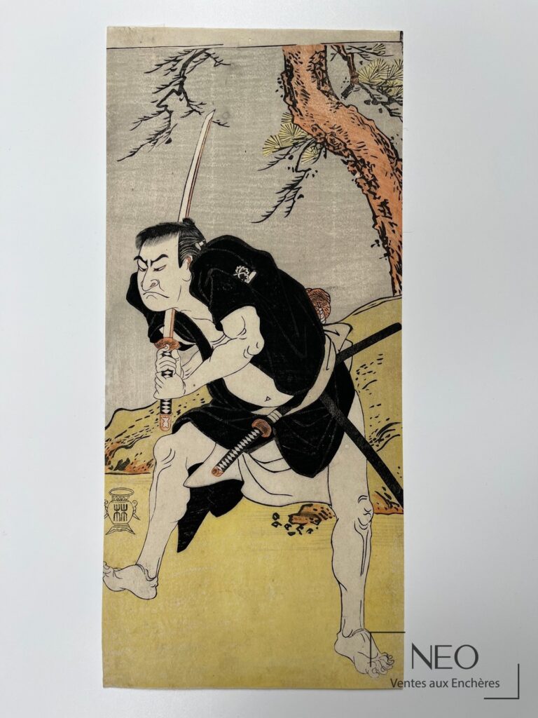 Estampe japonaise montrant un combattant au sabre sous un arbre