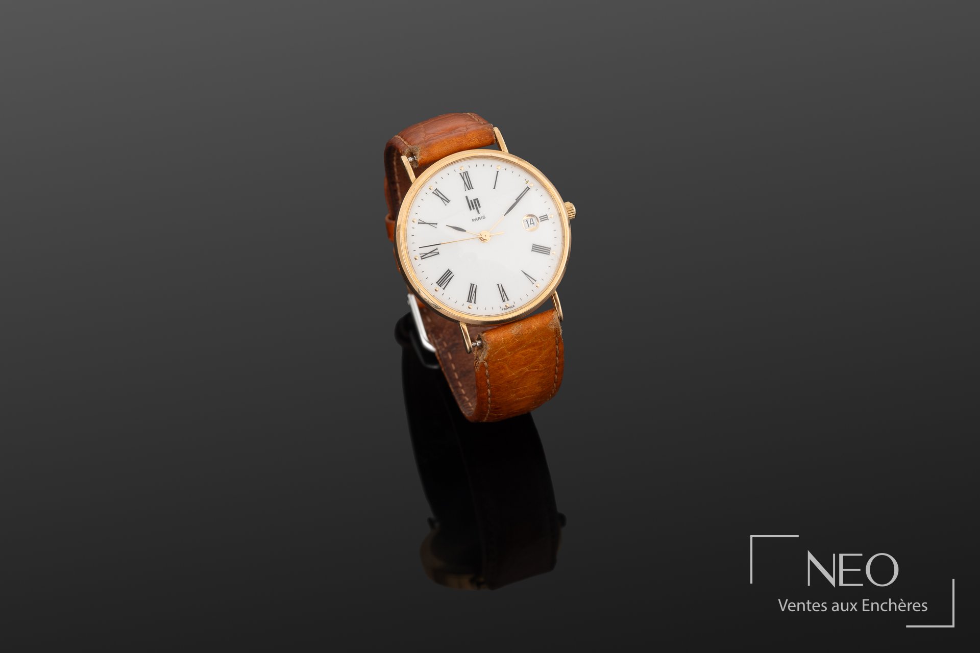 Montre LIP en or jaune avec cadran blanc