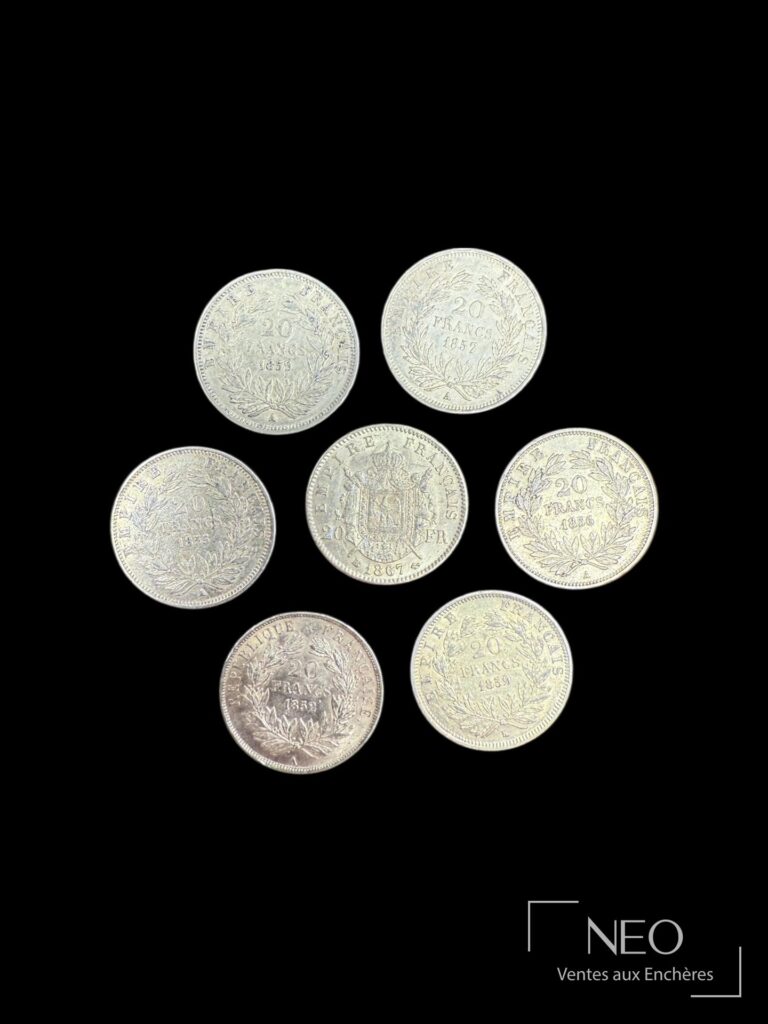 Sept pièces de 20 francs or vues sur leur revers