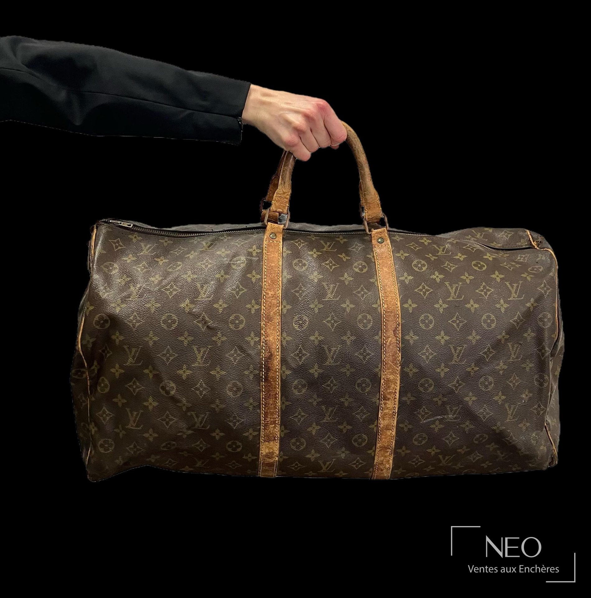 Louis Vuitton Keepall sac de voyage en toile monogrammée et cuir