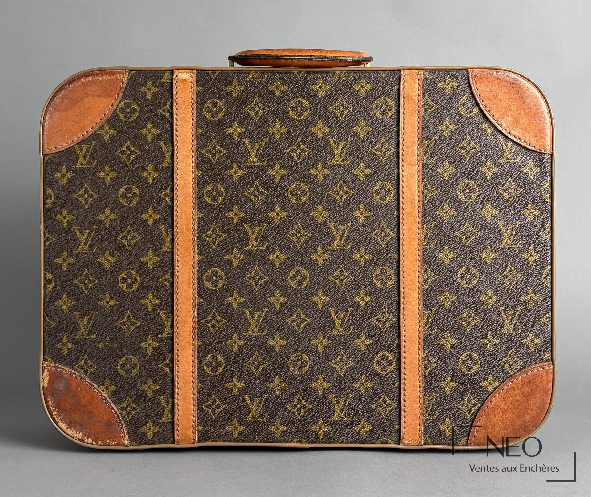 Petite valise Louis Vuitton en toile Monogram avec renforts en cuir patiné