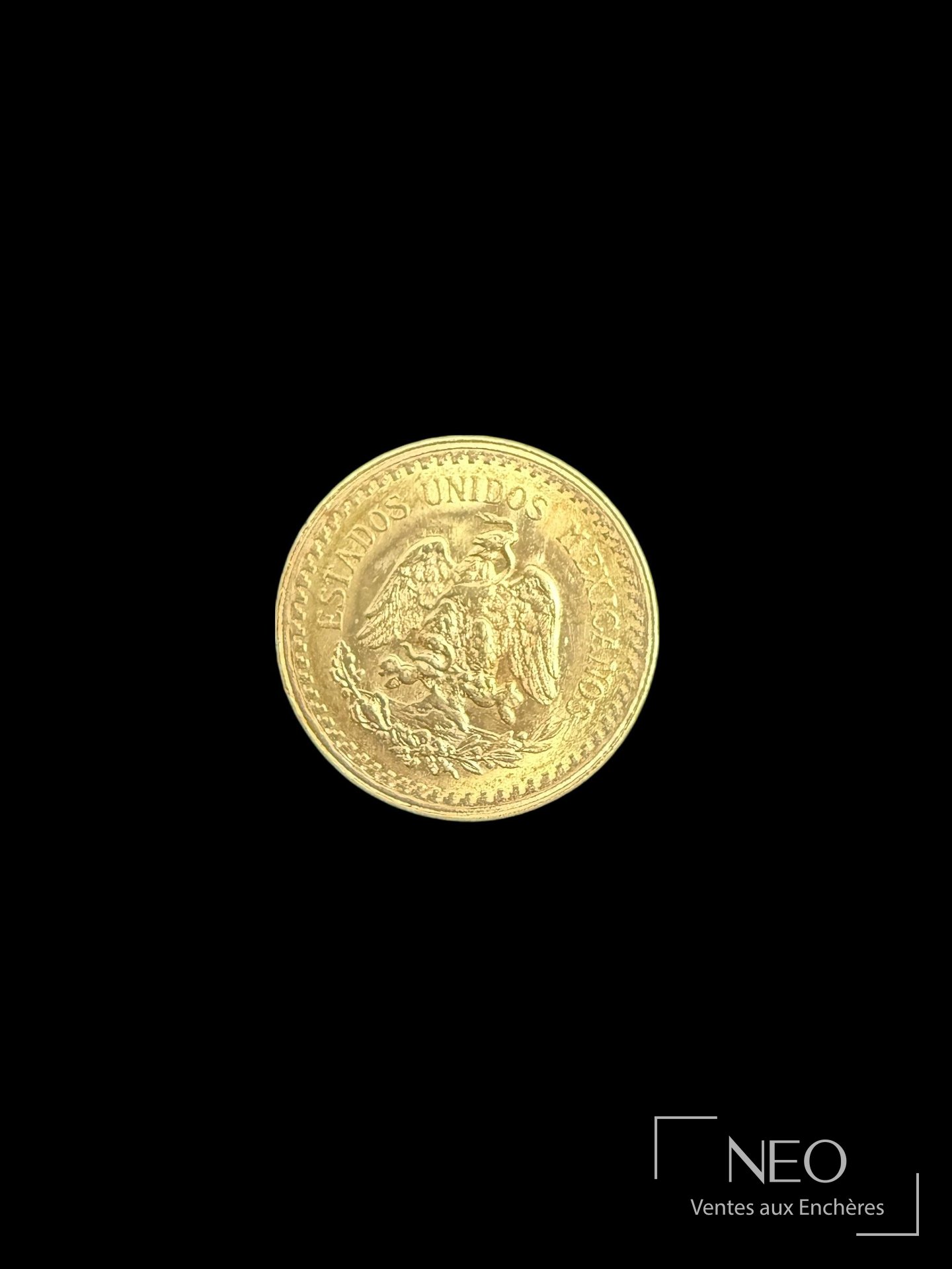 Pièce mexicaine en or montrant l'aigle et l'inscription Estados Unidos Mexicanos