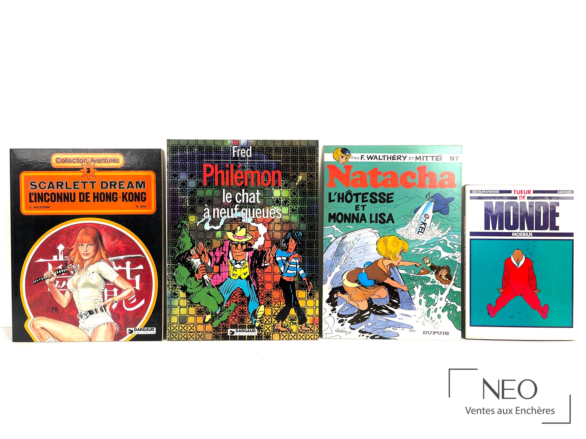 Quatre albums de bande dessinée présentés de face