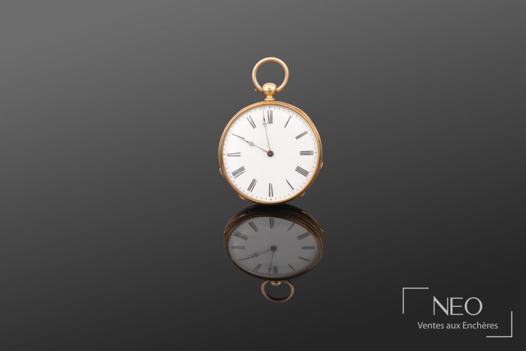 Montre à gousset en or jaune avec cadran émaillé blanc à chiffres romains