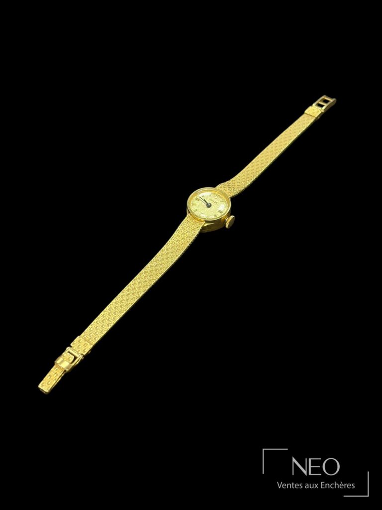 Montre bracelet Guilde en or jaune sur fond noir