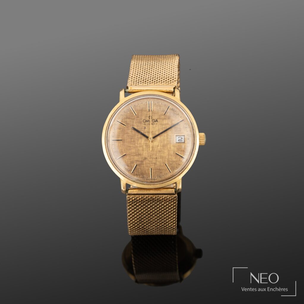 Montre Omega De Ville en or jaune avec cadran doré et guichet date à 3 heures