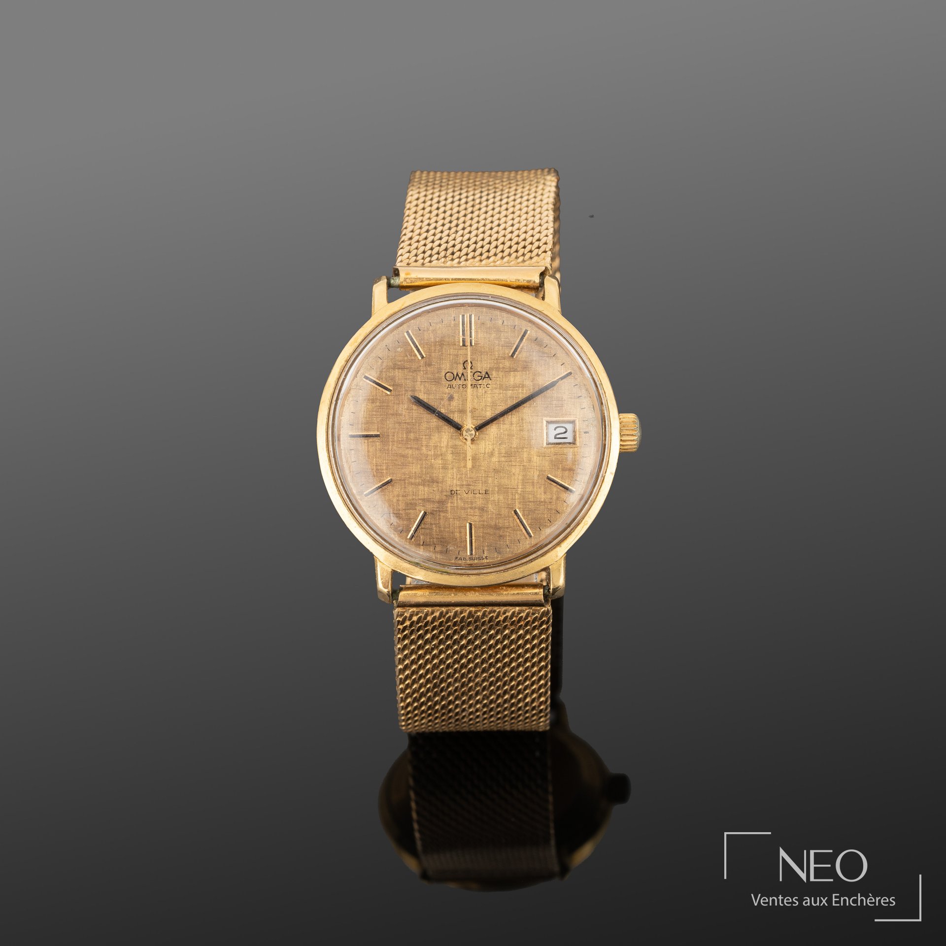 Montre Omega De Ville en or jaune avec cadran doré et guichet date à 3 heures