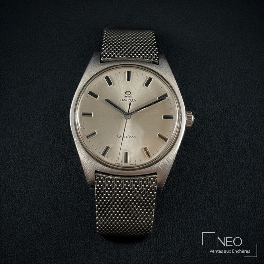 Montre Omega Genève en acier avec cadran argenté et bracelet maille milanaise