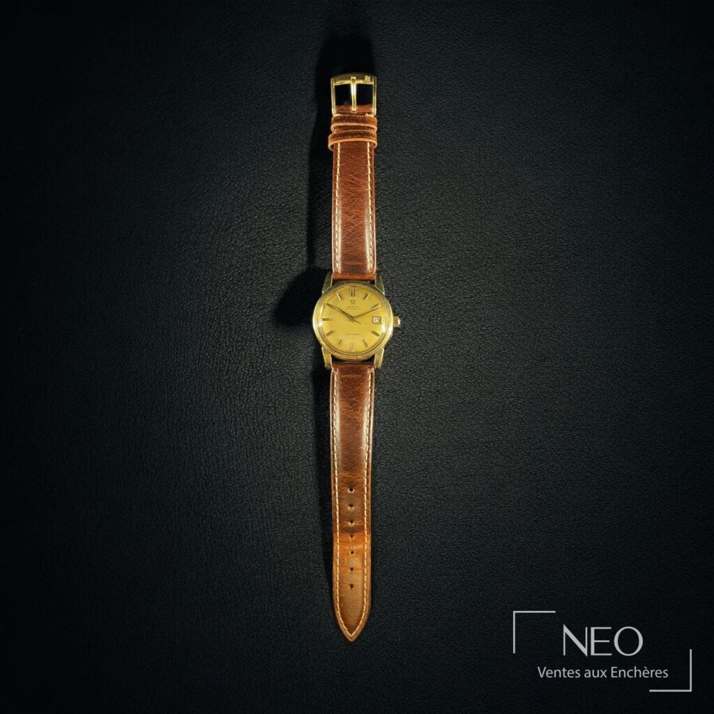 Montre Omega Seamaster plaquée or sur bracelet cuir marron