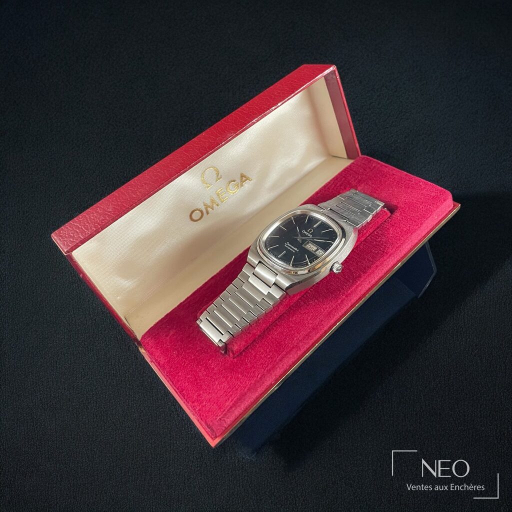 Montre OMEGA Seamaster Day-Date dans son écrin rouge et crème