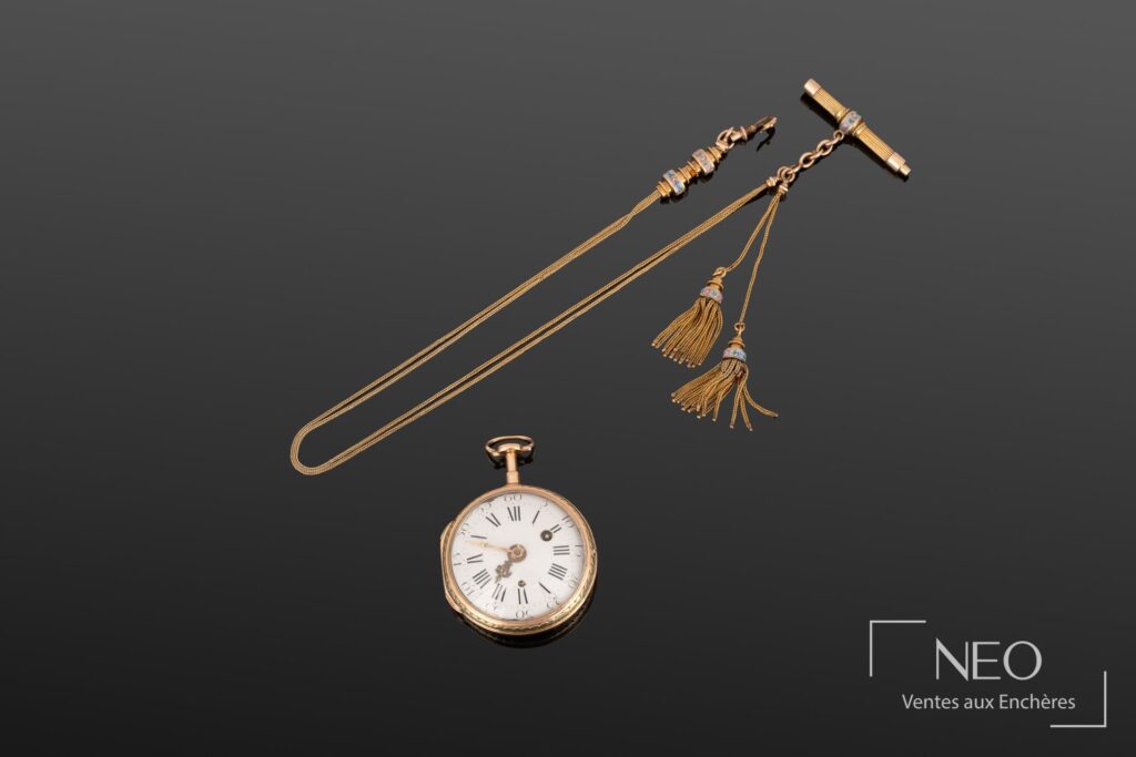 Montre à gousset en or 18 carats avec chaîne assortie